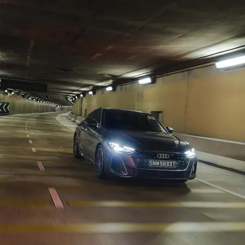 Audi driving through a tunnel at night